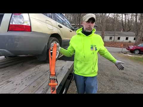How to tie down a vehicle to a trailer.