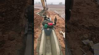 Construction of concrete irrigation canals- Good tools and machinery make work easy