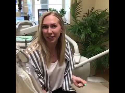 Blonde woman sitting in dental chair in West Caldwell dental office