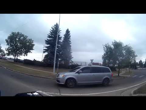 VERY DUMB KAREN IN HER DODGE TRIES TO HIT A BIKER DRUNK OR HIGH DRIVER