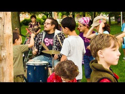 Renard frak playing drum in a Park