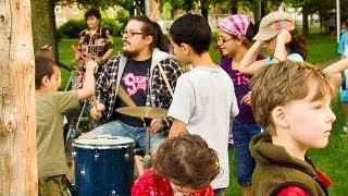 Renard frak playing drum in a Park