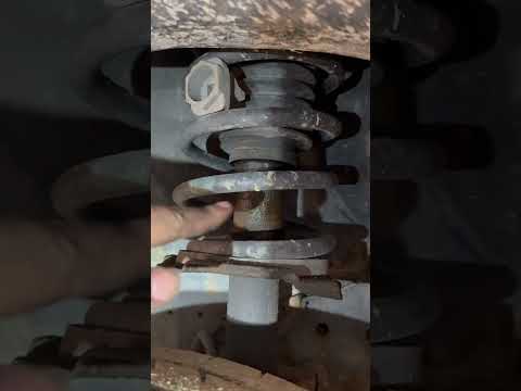 Mechanic find of the day! Vehicle sits lopsided Cheap coil spring spacer on only one side. #mechanic