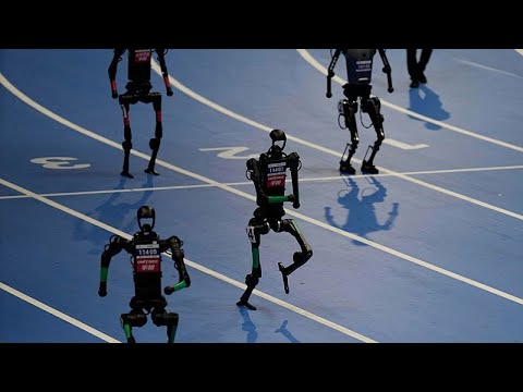WATCH: Robots sprint and play football at first world games in Beijing