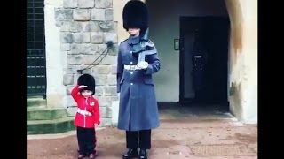 Boy Dressed as British Guard Salutes Windsor Castl