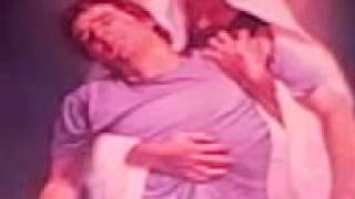 jesus holding man with hammer and a nail