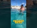DAD TEACHES CHILD TO BREATHE WHILE SWIMMING