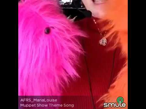 Maria Louise and her puppets singing theme from The Muppet Show