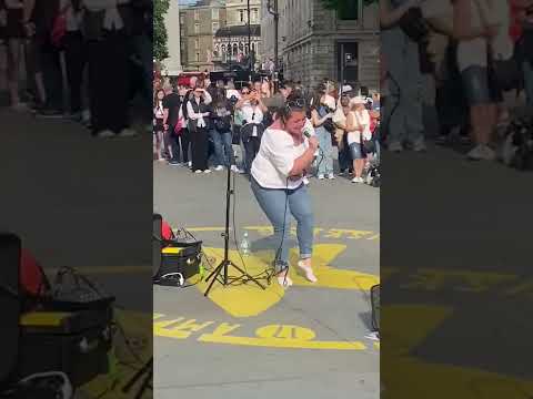 Trafalgar Square White Female Busker Performing Original Classic Reggae Songs
