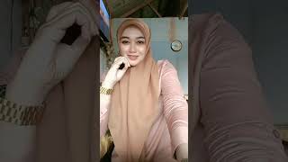 Beautiful, sweet, natural hijab mother live sitting relaxed, silent