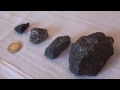 Black magnetic rocks collected at Bramfield, testing with a rare-earth magnet