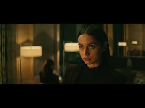 Official Ballerina trailer thumbnail showing Ana de Armas as Eve in a neon-lit corridor