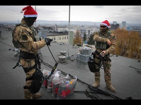 Polish counter-terrorism officers help deliver presents to children in a hospital via a robot