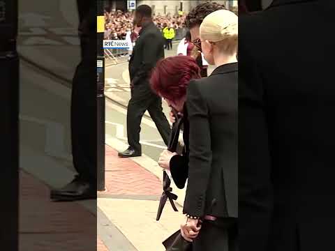 Tearful Sharon Osbourne lays flowers for late husband Ozzy