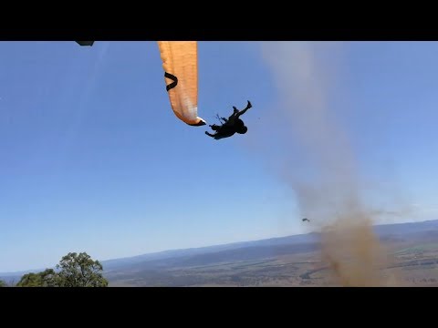 Dust devil sends paraglider flying