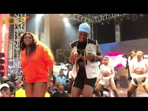 Niniola and a sexy fine boy fan in dance drama on stage,makes crowd shouting uncontrollably.