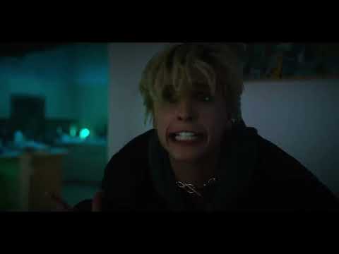 Smile 2 trailer frame: closing shot of Skye cycling away from arena lights into dark city canyons