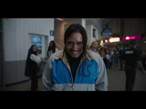 Smile 2 official trailer still: pop star Skye Riley onstage with ominous grin-lit crowd