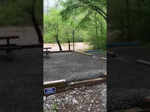 Brief walk-in tent site video during heavy rains