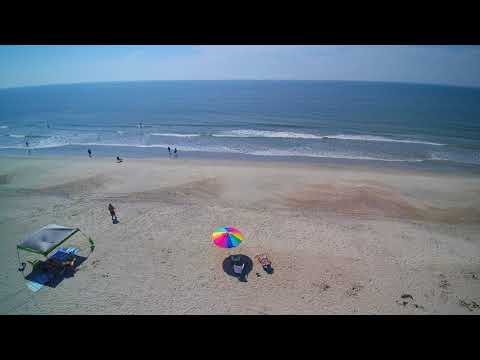 Short drone video of over all beach side campground. Site 10 with the green chair.