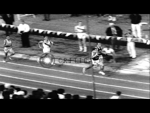 Players compete at various track and field events like mile race, shot put, hamme...HD Stock Footage