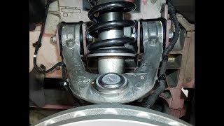 Changing the Front Suspension Upper Control Arms in an Aston Martin DB9 or Vantage