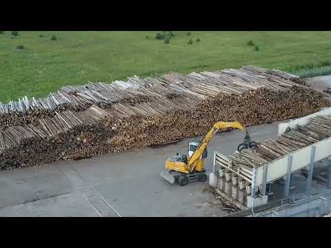 Liebherr 974 Excavator Loading Blasted Rock Onto CAT 775B Dumper At Quarry - Sotiriadis/Labrianidis