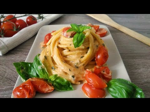 Spaghetti con pomodorini e crema al basilico