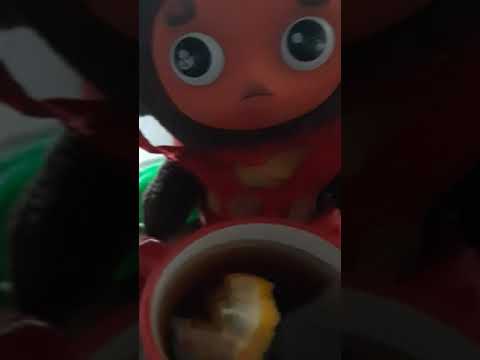 Cheburashka drinking tea with lemon