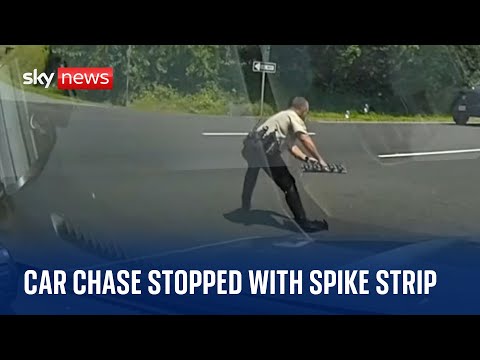 US: Police officer stops car chase by bursting suspect's tyres with spike strip