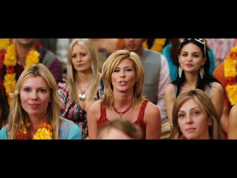 Crowd and characters reacting during a Love Guru music sequence