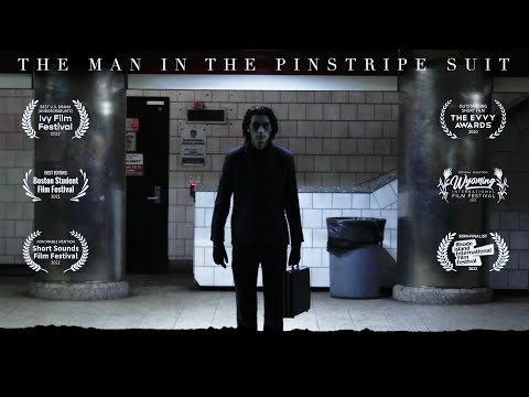 The Man in the Pinstripe Suit
