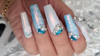 Summer chrome nails with textured 3D nail art.