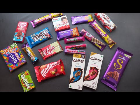 100 candies opening, surprise toys, chocolate a video, lots of chocolates, Cadbury celebration