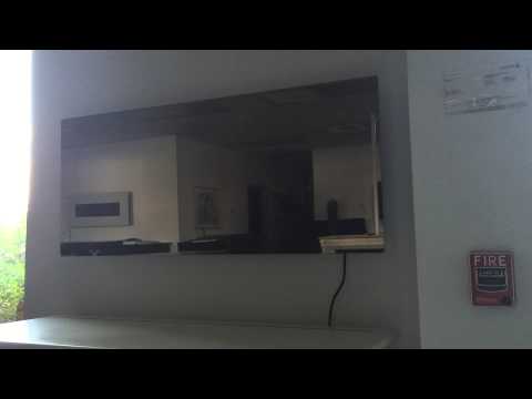 Touchstone Mirror Onyx Wall mounted electric fireplace Video