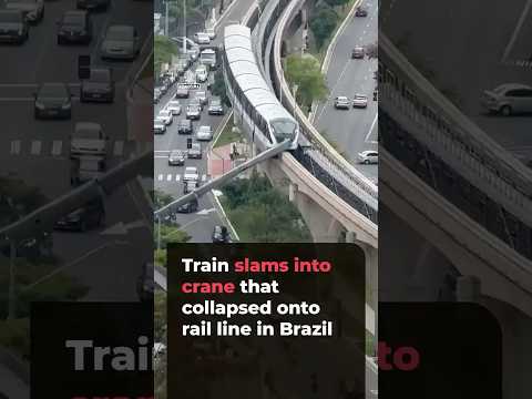 Train slams into crane that collapsed onto railway line in Brazil