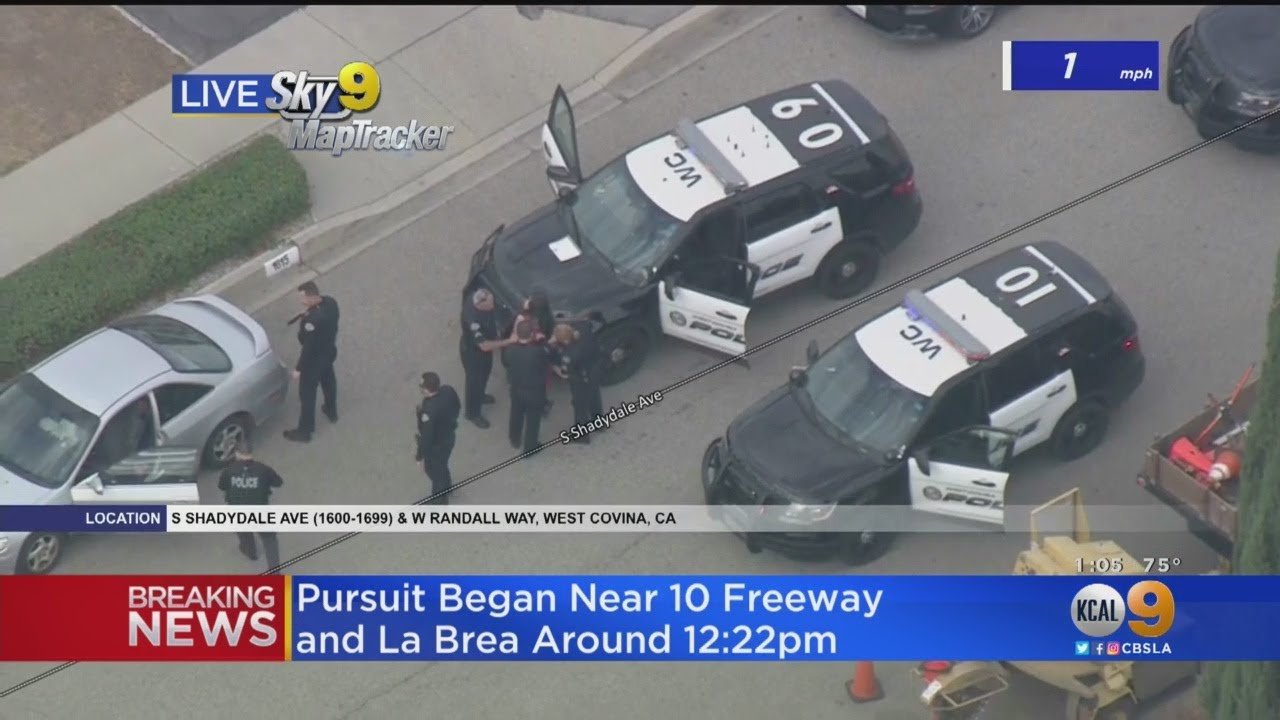 Pursuit Suspect In Red Dress Places Piece Of Paper On Patrol Car, Surrenders