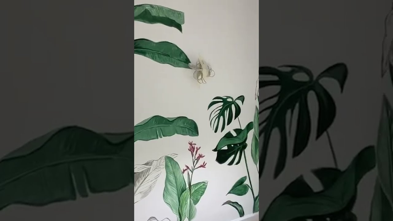 Salón tropical con un mural pintado a mano! 🏝