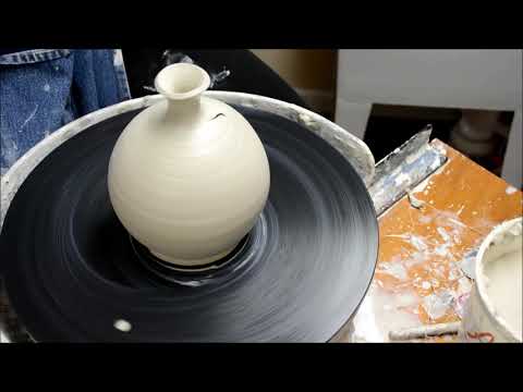 Throwing a Vase with a Blown Belly on the Potter's Wheel
