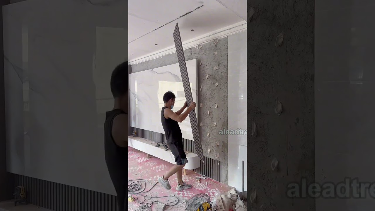 Sintered stone TV background wall installation #interiordesign #walldesign