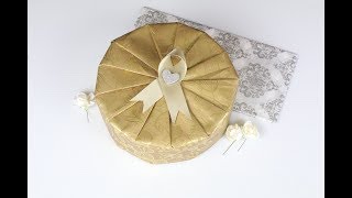 Wrapping a Circular Gift with Golden Garden Wrapping Paper