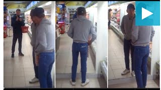 Drunk man tries to manoeuvre past his own reflection in mirror