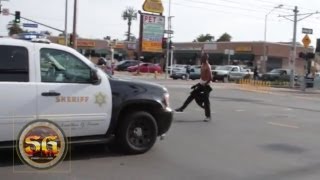 Man on PCP challenges police vehicle in South Los Angeles before being arrested