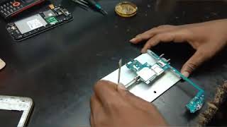 How to remove Samsung J2 SIM tray and memory tray using soldering technique.