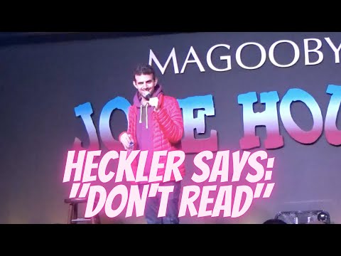 Heckler tells comedian Sam Morril not to read.