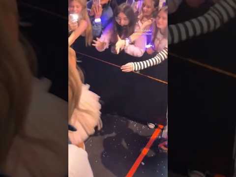 Olivia Rodrigo gives Amy Acton flowers during Ohio concert