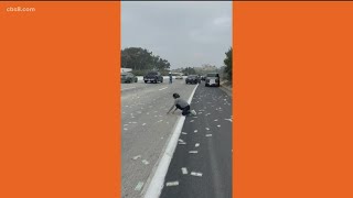 Cash on San Diego freeway | Traffic incident with armored vehicle causes chaos on Interstate 5
