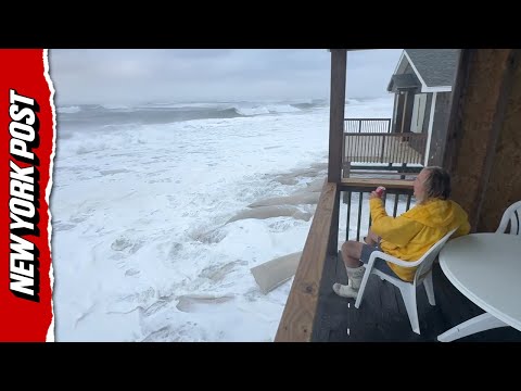 Resident Calmly Sitting On Porch While Hurricane Erin Pounds Outer Banks Shoreline