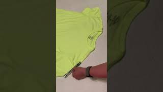Cutting an 80s, off the shoulder t-shirt