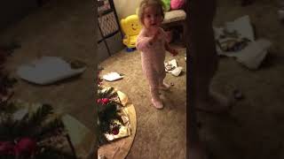 “ Go away Mama!!” Lexie unwraps her Christmas presents early